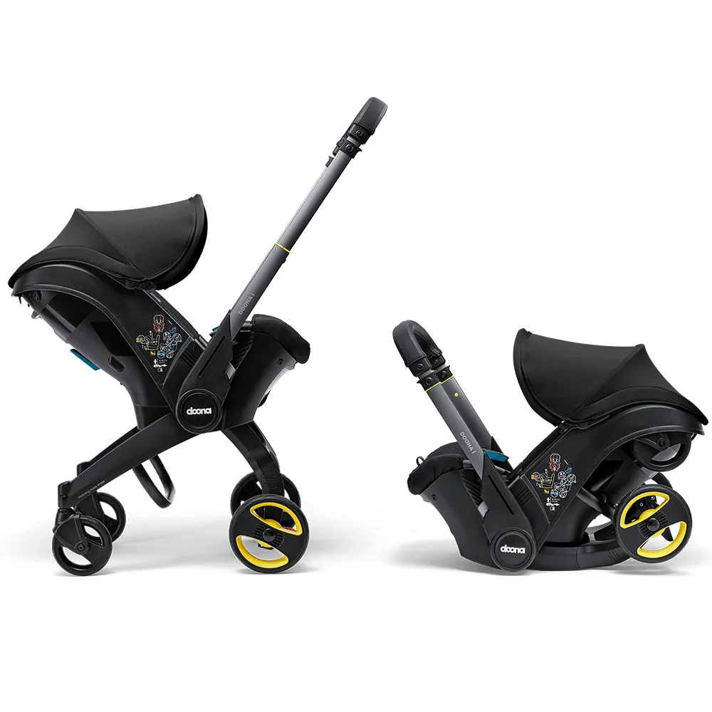 https://www.roshko.bg/media/catalog/product/cache/1/image/9df78eab33525d08d6e5fb8d27136e95/2/_/Doona™ i-size Седалка с шаси 2 в 1 - Nitro Black.webp