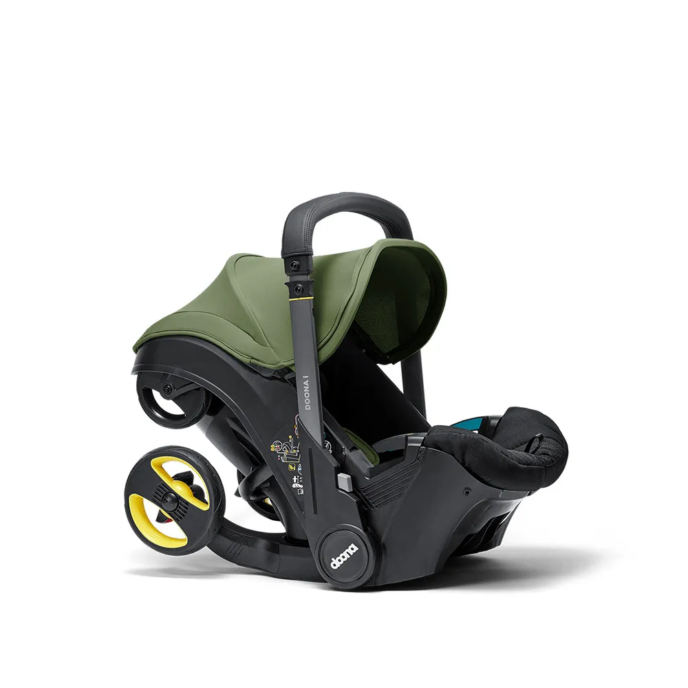 https://www.roshko.bg/media/catalog/product/cache/1/image/9df78eab33525d08d6e5fb8d27136e95/d/o/Doona™ i-size Седалка с шаси 2 в 1 - Desert Green.webp