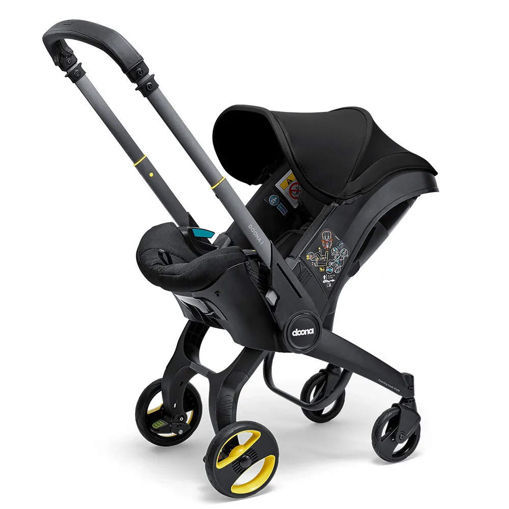 https://www.roshko.bg/media/catalog/product/cache/1/image/9df78eab33525d08d6e5fb8d27136e95/d/o/Doona™ i-size Седалка с шаси 2 в 1 - Nitro Black.webp
