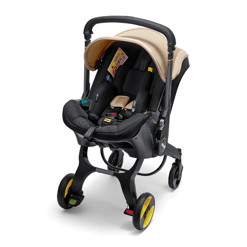 https://www.roshko.bg/media/catalog/product/cache/1/image/9df78eab33525d08d6e5fb8d27136e95/d/o/Doona™ i-size Седалка с шаси 2 в 1 - Sahara Sand.webp
