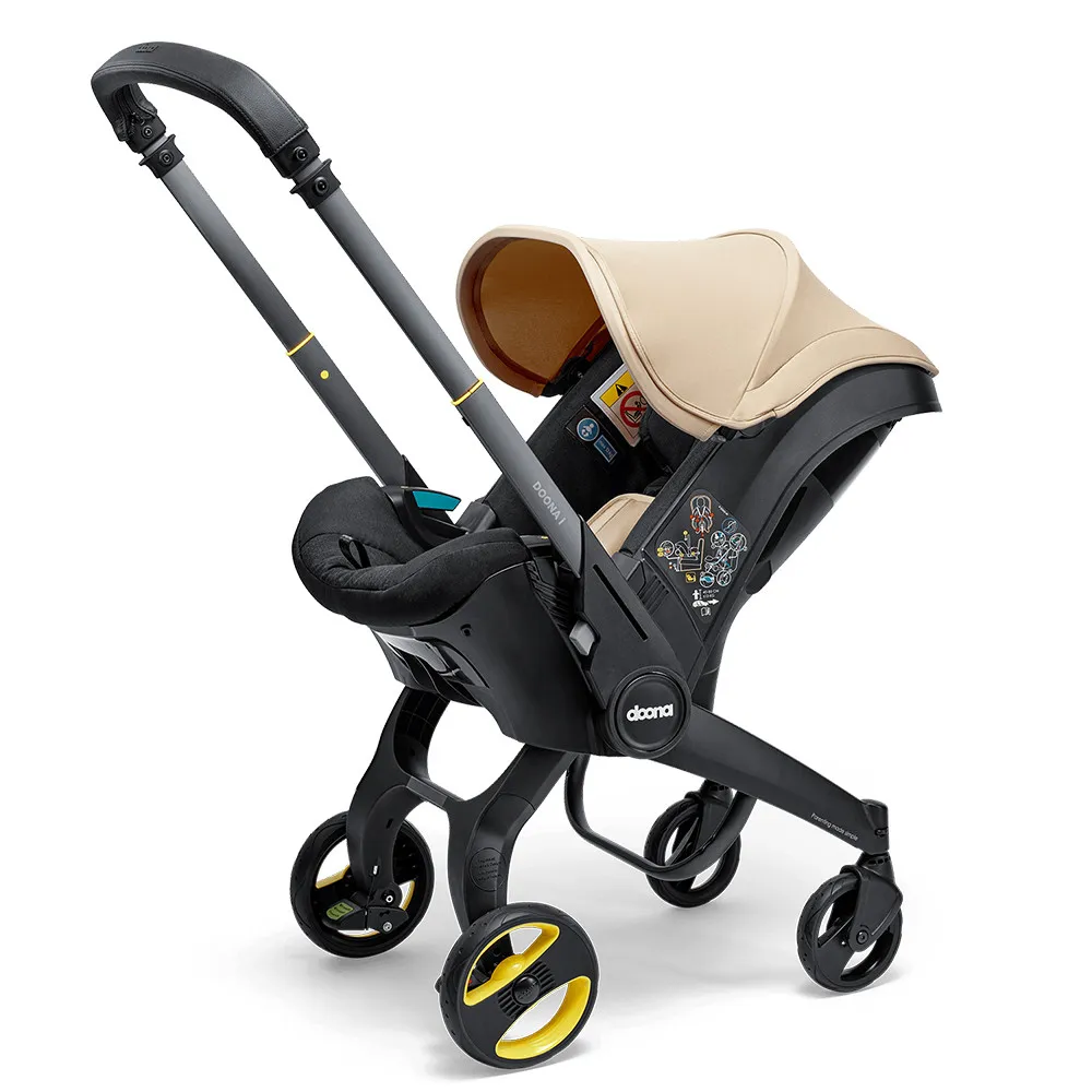 https://www.roshko.bg/media/catalog/product/cache/1/image/9df78eab33525d08d6e5fb8d27136e95/d/o/Doona™ i-size Седалка с шаси 2 в 1 - Sahara Sand.webp
