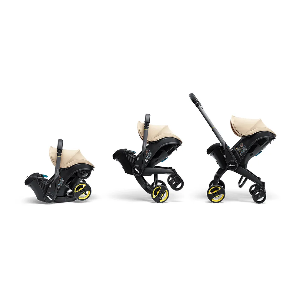 https://www.roshko.bg/media/catalog/product/cache/1/image/9df78eab33525d08d6e5fb8d27136e95/d/o/Doona™ i-size Седалка с шаси 2 в 1 - Sahara Sand.webp
